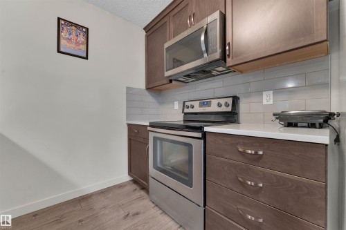 106 4008 Savaryn Drive, Edmonton, AB - Indoor Photo Showing Kitchen With Stainless Steel Kitchen