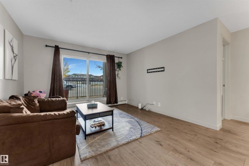 106 4008 Savaryn Drive, Edmonton, AB - Indoor Photo Showing Living Room