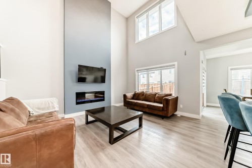 1227 24 Street, Edmonton, AB - Indoor Photo Showing Living Room With Fireplace