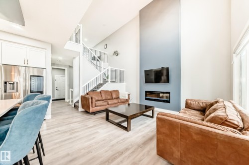 1227 24 Street, Edmonton, AB - Indoor Photo Showing Living Room With Fireplace