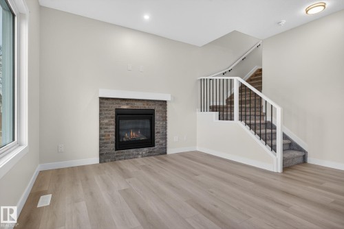 4904 49 Avenue, Gibbons, AB - Indoor Photo Showing Living Room With Fireplace