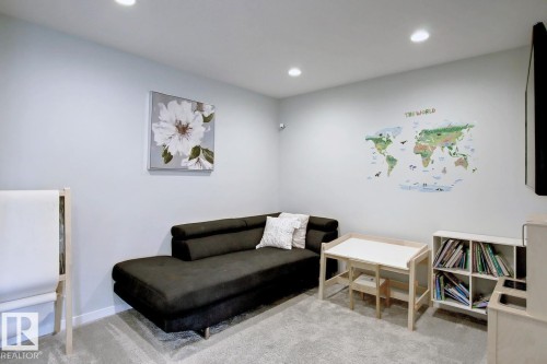 Sitting room with light colored carpet and recessed lighting - 19633 26A Av, Edmonton, AB - Indoor