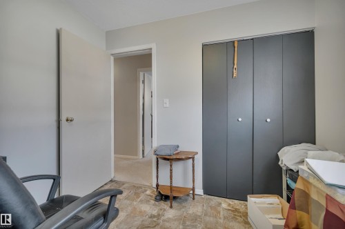 Bedroom with stone finish flooring and a closet - 5312 36 Ave, Wetaskiwin, AB - Indoor
