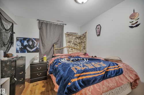 Bedroom featuring wood finished floors - 5312 36 Ave, Wetaskiwin, AB - Indoor Photo Showing Bedroom