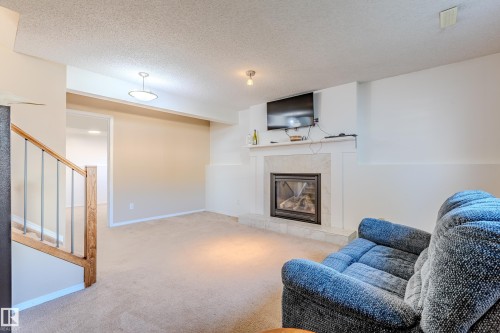 8808 102 Avenue, Morinville, AB - Indoor Photo Showing Living Room With Fireplace