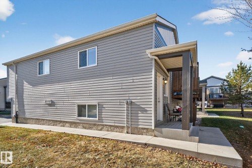 View of side of property featuring a lawn - 196, 142 Selkirk Place, Leduc, AB - Outdoor