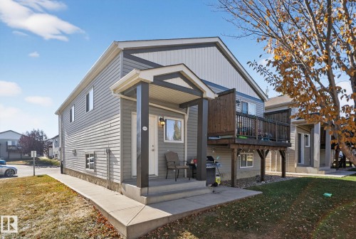 View of front facade featuring a front yard and a deck - 196, 142 Selkirk Place, Leduc, AB - Outdoor