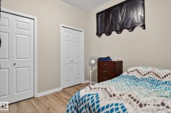 Bedroom with two closets and light wood-style floors - 