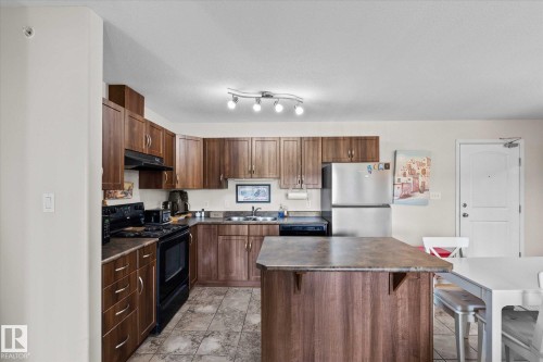 433 50 Woodsmere Close, Fort Saskatchewan, AB - Indoor Photo Showing Kitchen With Double Sink