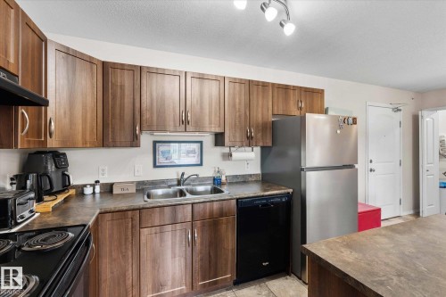 433 50 Woodsmere Close, Fort Saskatchewan, AB - Indoor Photo Showing Kitchen With Double Sink