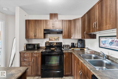 433 50 Woodsmere Close, Fort Saskatchewan, AB - Indoor Photo Showing Kitchen With Double Sink