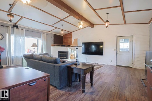 4 54222 Rge Road 25, Rural Lac Ste. Anne County, AB - Indoor Photo Showing Living Room With Fireplace