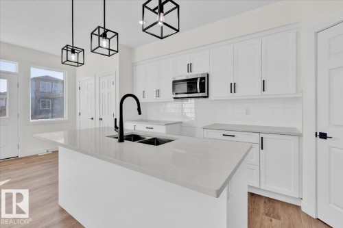 227 Deer Valley Drive, Leduc, AB - Indoor Photo Showing Kitchen With Double Sink