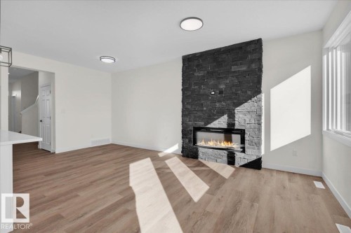 227 Deer Valley Drive, Leduc, AB - Indoor Photo Showing Living Room With Fireplace