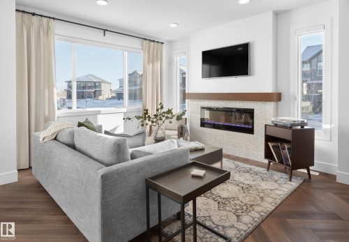 2427 Chokecherry Link, Edmonton, AB - Indoor Photo Showing Living Room With Fireplace