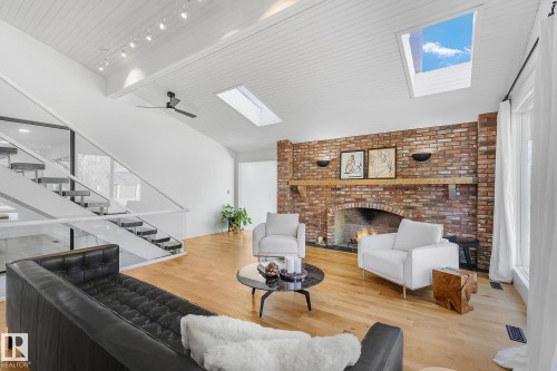 100 Wolf Willow Crescent, Edmonton, AB - Indoor Photo Showing Living Room With Fireplace
