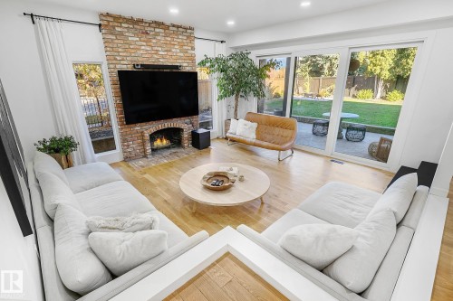 100 Wolf Willow Crescent, Edmonton, AB - Indoor Photo Showing Living Room With Fireplace