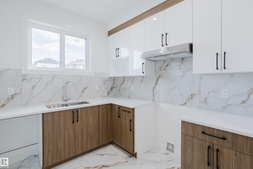 4105 67 Street, Beaumont, AB - Indoor Photo Showing Kitchen With Double Sink