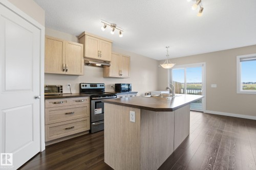 3217 11 Avenue, Edmonton, AB - Indoor Photo Showing Kitchen With Double Sink
