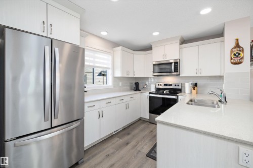 61 165 Cy Becker Boulevard, Edmonton, AB - Indoor Photo Showing Kitchen With Stainless Steel Kitchen With Double Sink