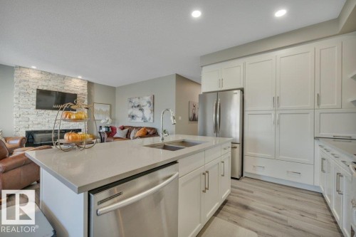 477 Roberts Crescent, Leduc, AB - Indoor Photo Showing Kitchen With Fireplace With Double Sink With Upgraded Kitchen