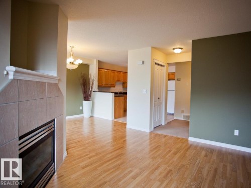 32 2505 42 Street, Edmonton, AB - Indoor Photo Showing Other Room With Fireplace