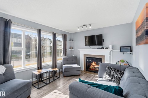 3908 161 Avenue Nw, Edmonton, AB - Indoor Photo Showing Living Room With Fireplace
