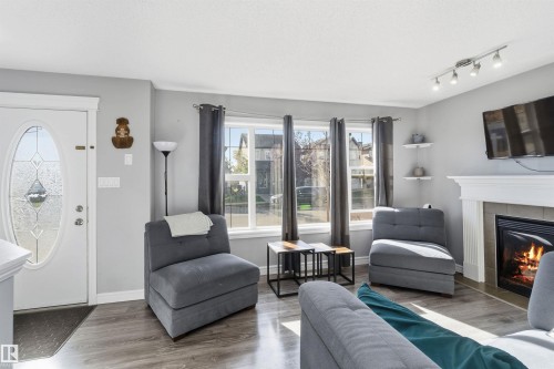 3908 161 Avenue Nw, Edmonton, AB - Indoor Photo Showing Living Room With Fireplace