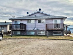 Rear view of house with a balcony and a shingled roof - 