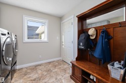 Mudroom with baseboards and washing machine and dryer - 