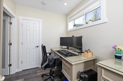 Home office with dark wood-style flooring - 