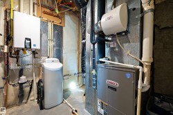 Utility room with tankless water heater - 