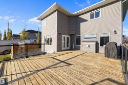 Wooden terrace with area for grilling and french doors - 