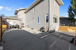 Rear view of property featuring a patio area - 