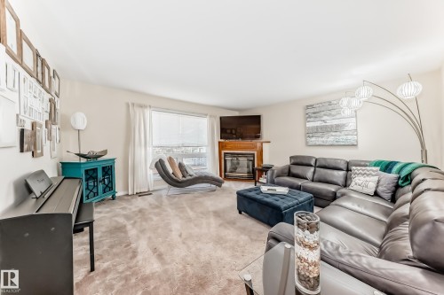 216 Parkallen Way, Wetaskiwin, AB - Indoor Photo Showing Living Room With Fireplace