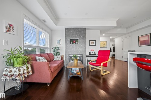 405 10232 115 St Nw, Edmonton, AB - Indoor Photo Showing Living Room With Fireplace