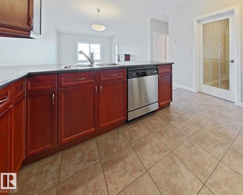 318 160 Magrath Road, Edmonton, AB - Indoor Photo Showing Kitchen With Double Sink