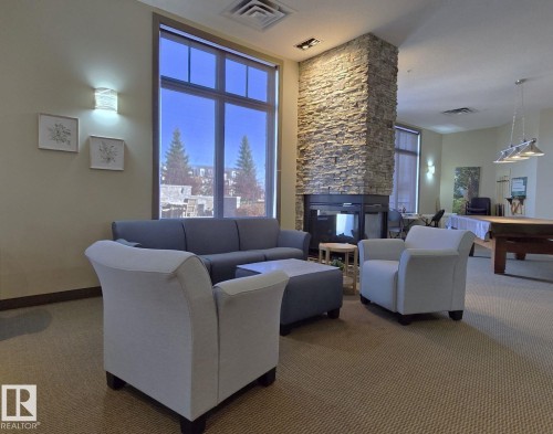 318 160 Magrath Road, Edmonton, AB - Indoor Photo Showing Living Room With Fireplace