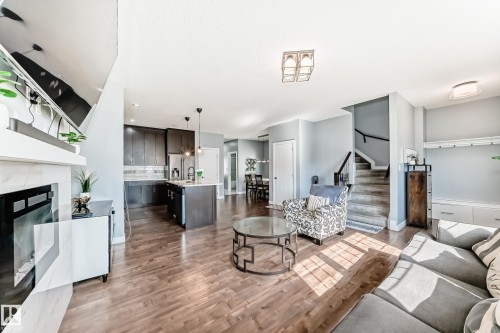 2716 11 Street, Edmonton, AB - Indoor Photo Showing Living Room With Fireplace