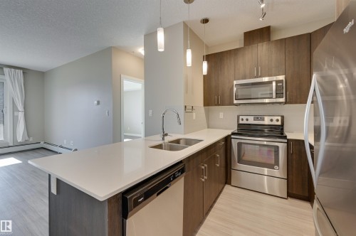 205 17 Columbia Avenue, Devon, AB - Indoor Photo Showing Kitchen With Stainless Steel Kitchen With Double Sink With Upgraded Kitchen