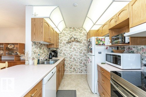 301 911 Rabbit Hill Road, Edmonton, AB - Indoor Photo Showing Kitchen With Double Sink