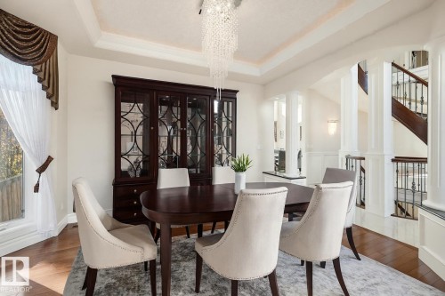 Virtually staged formal dining room - 872 Hollands Landing, Edmonton, AB - Indoor Photo Showing Dining Room