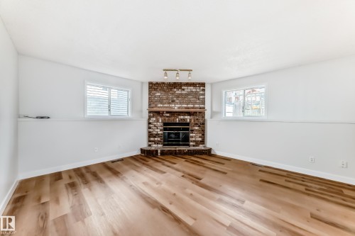 1141 60 Street, Edmonton, AB - Indoor Photo Showing Living Room With Fireplace