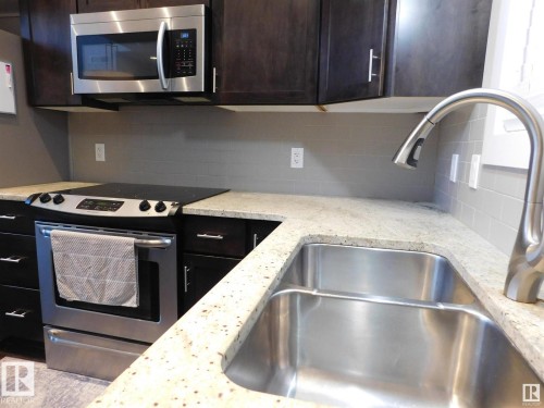 50 11518 76 Avenue, Edmonton, AB - Indoor Photo Showing Kitchen With Double Sink
