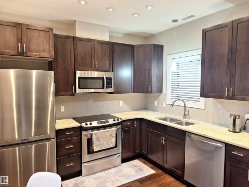 50 11518 76 Avenue, Edmonton, AB - Indoor Photo Showing Kitchen With Double Sink