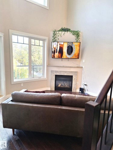 50 11518 76 Avenue, Edmonton, AB - Indoor Photo Showing Other Room With Fireplace