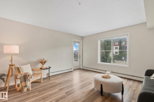 210 5804 Mullen Place, Edmonton, AB - Indoor Photo Showing Living Room