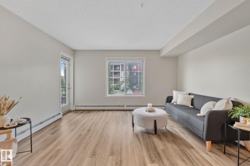 210 5804 Mullen Place, Edmonton, AB - Indoor Photo Showing Living Room