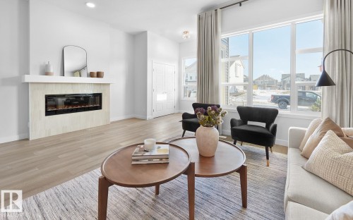 2224 Muckleplum Crescent, Edmonton, AB - Indoor Photo Showing Living Room With Fireplace