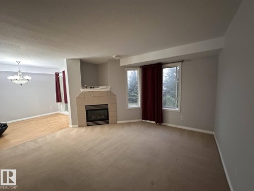 2 2505 42 Street, Edmonton, AB - Indoor Photo Showing Other Room With Fireplace